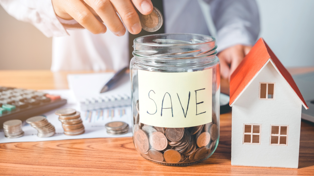 an image with a person putting money in a jar