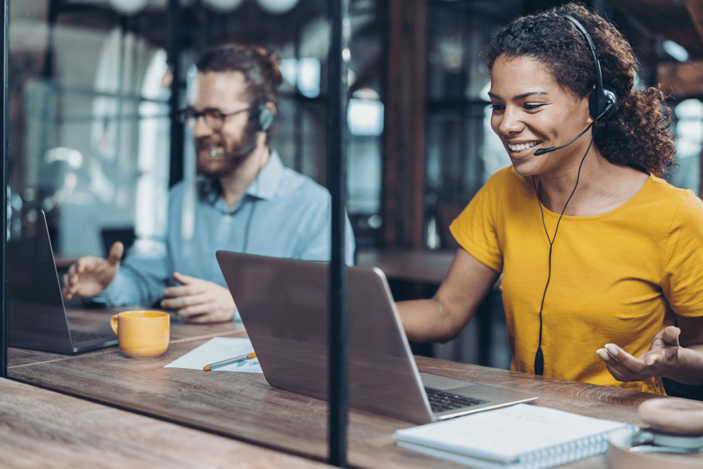 a smiling woman and man customer service representatives