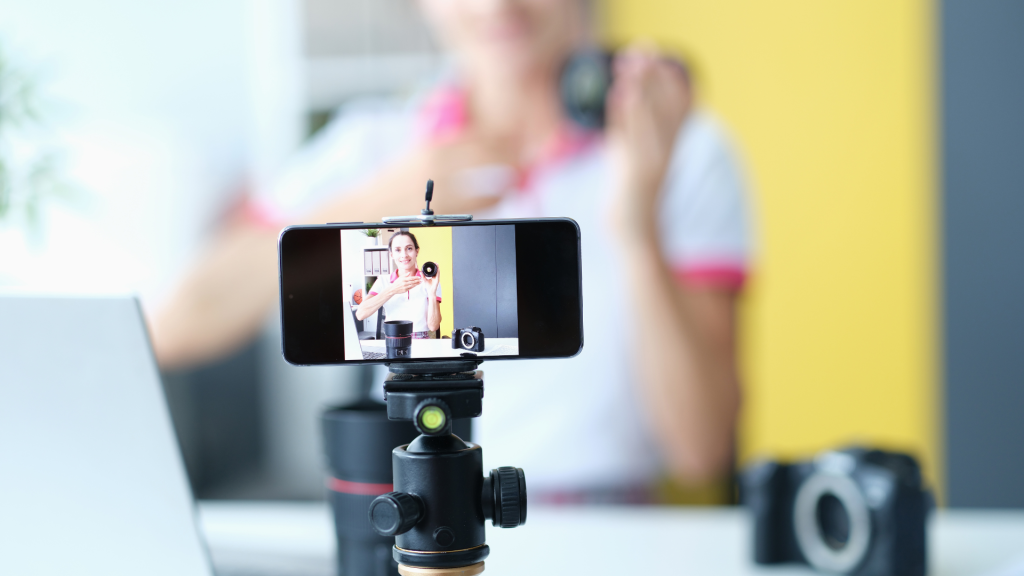 a woman in front of a mobile phone camera