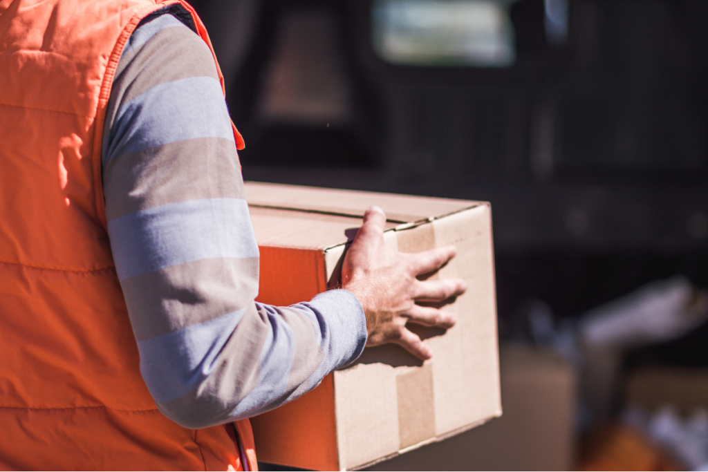 a delivery person holding a parcel