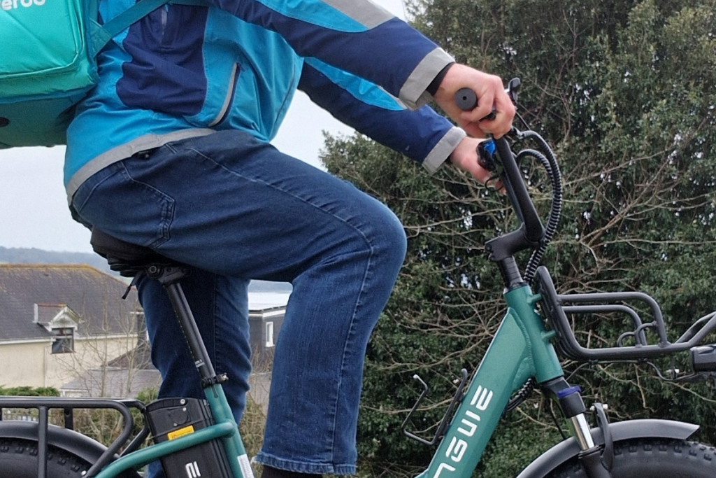 A delivery rider on an Engwe L20 Boost e-bike