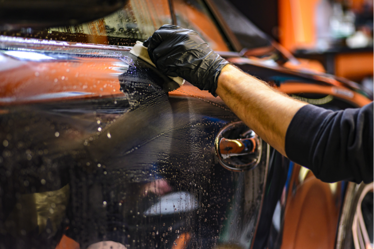 a person valeting a car