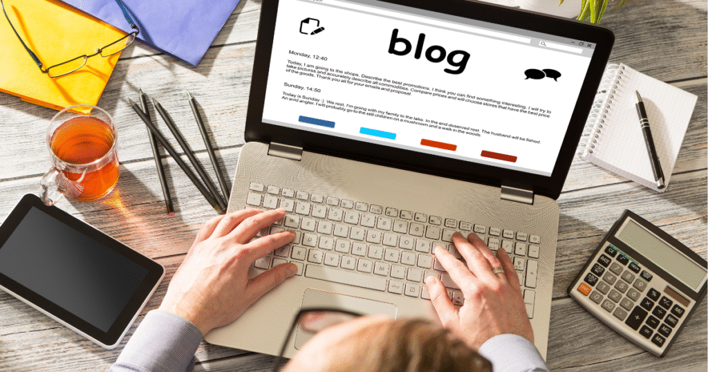 a person on a laptop with a blog on the screen